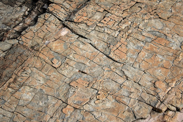 Large Rocks with Striations and Grooves on the Shore Path Bar Harbor Maine Unique rocks with interesting and intricate textures. Beautiful path along the Atlantic ocean featuring all types of rocks.