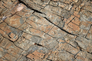 Large Rocks with Striations and Grooves on the Shore Path Bar Harbor Maine Unique rocks with interesting and intricate textures. Beautiful path along the Atlantic ocean featuring all types of rocks.