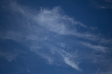 Fluffy Little Clouds. Blue skies and wispy clouds on a gorgeous summer day.