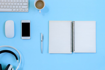 The office blue desk and equipment for working with coffee in top view and flat ray concept.