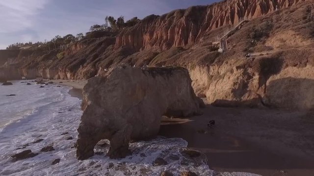 Aerial, drone shot, of El Matador State Beach, in Malibu, California at Sunset