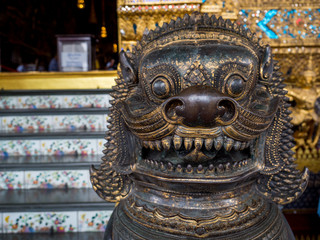 Fototapeta premium Lion Guarddians, Grand palace and Wat phra keaw in Bangkok, Thailand, May 2019
