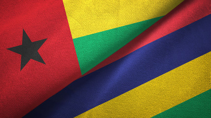 Guinea-Bissau and Mauritius two flags textile cloth, fabric texture