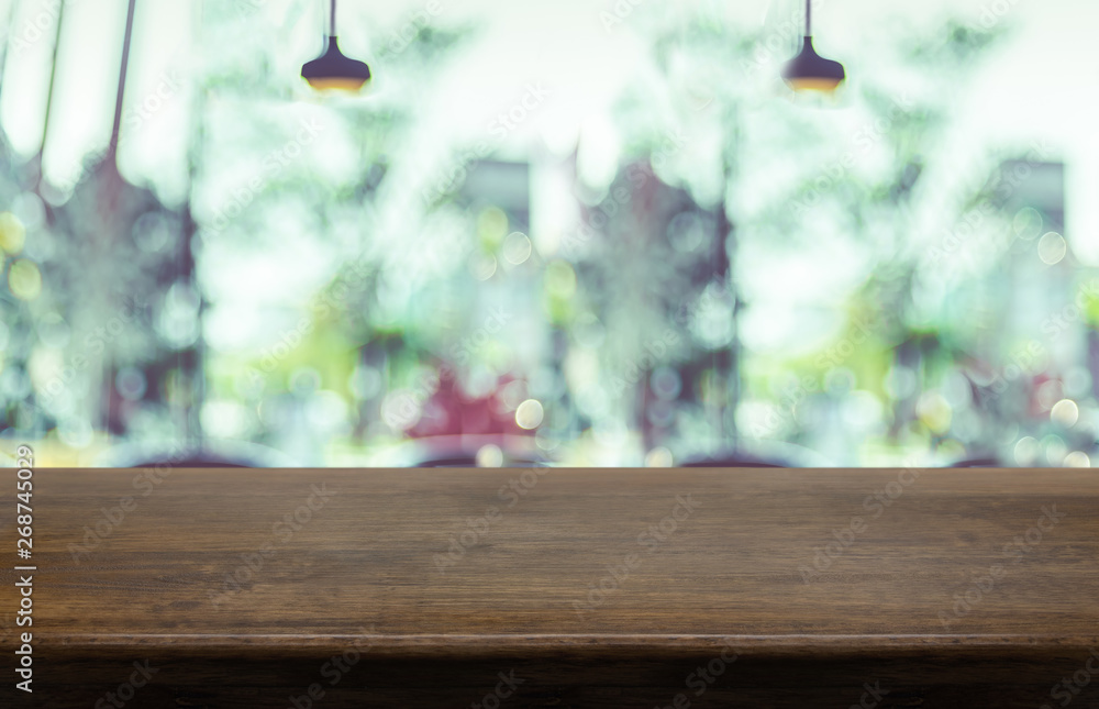 Poster empty wood table top with blurred cafe restaurant background. mock up for display or montage of prod