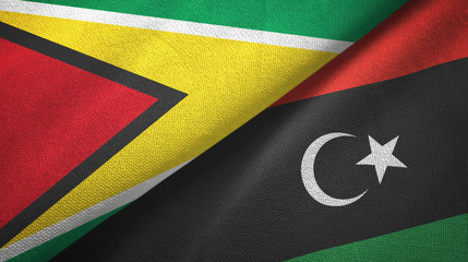 Guyana and Libya two flags textile cloth, fabric texture