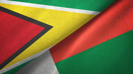 Guyana and Madagascar two flags textile cloth, fabric texture