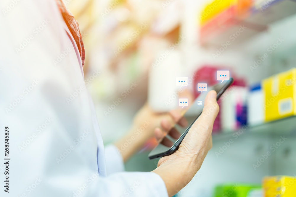 Wall mural close up hand of woman pharmacist holding prescription checking medicine with client online, social 