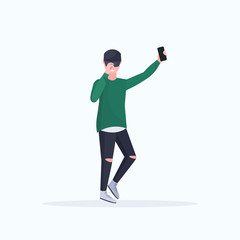 man taking selfie photo on smartphone camera casual male cartoon character posing on white background flat full length