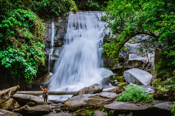 Women travel. woman asia travelers travel nature Forests, mountains, waterfalls. Travel Siliphum Waterfall at Chiangmai, in  Thailand.