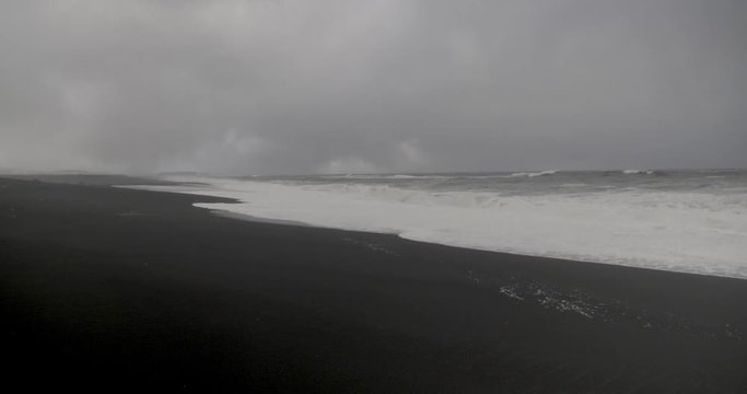 Waves approaching a black sand beach in Iceland.