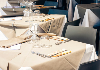 Serving on the table on terrace in the restaurant in Catania, Sicily, Italy, setting for diner.