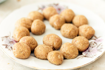 Preparing, cooking, making meatballs for homemade fried minced meat cutlets, traditional Ukrainian dish .