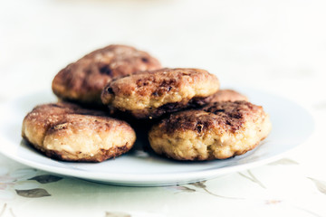 homemade fried minced meat cutlets on white plate, traditional Ukrainian dish .