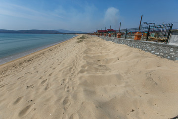 Construction of houses for the recreation center on the sandy sea beach. Construction of a resort area on the sea.