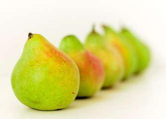 Fresh ripe pears on white background, vegetarian concept.