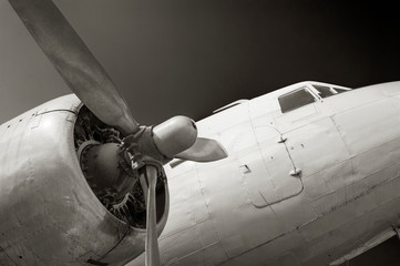 Close up on old airplane (biplane) with enormous propeller engine