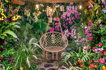 swing basket hanging chair in flower garden
