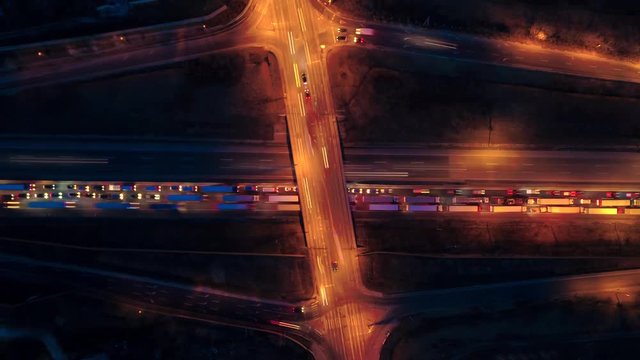 Night Long-exposure timelapse of a busy highway with a bridge crossing over.