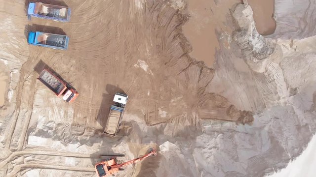 Sand Quarry. Work Excavator And Dump Truck. Aerial Shooting