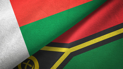 Fototapeta premium Madagascar and Vanuatu two flags textile cloth, fabric texture