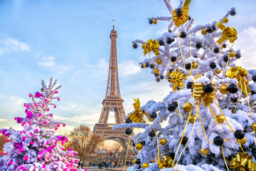 Eiffel Tower is the main attraction of Paris on the background of decorated Christmas trees in December. Travel Greeting Card with Christmas in Paris, France - 268754811