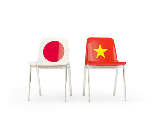 Two chairs with flags of Japan and vietnam isolated on white