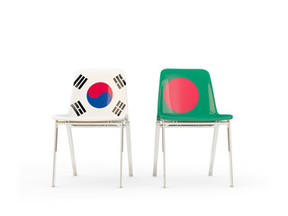 Two chairs with flags of South Korea and bangladesh isolated on white