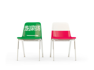 Two chairs with flags of Saudi Arabia and poland isolated on white