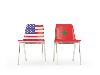 Two chairs with flags of United States and morocco isolated on white