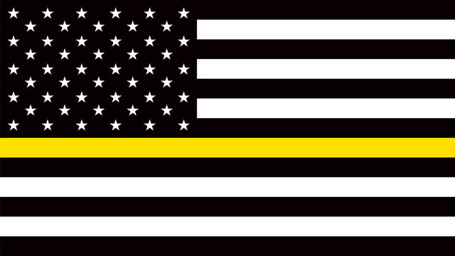 USA Flag With A Thin Yellow Or Gold Line - A Sign To Honor And Respect American Dispatchers, Security Guards And Loss Prevention.