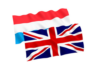 National fabric flags of Luxembourg and Great Britain isolated on white background. 3d rendering illustration. 1 to 2 proportion.