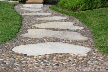Fototapeta premium Garden walk way with stone in nature