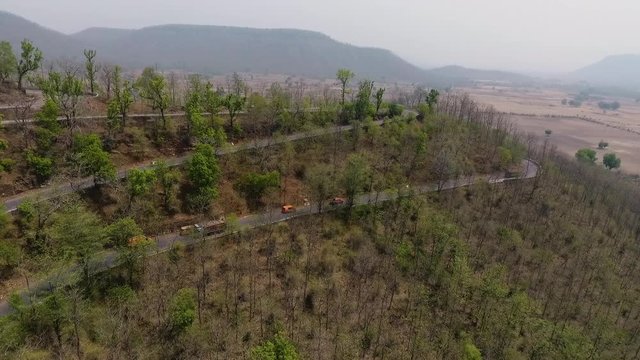 A dolly, aerial view of the amazing landscape that can be easily seen from the car while driving.