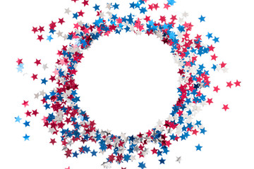 4th of July American Independence Day. Red, blue and white star confetti decorations on white background. Flat lay, top view, copy space