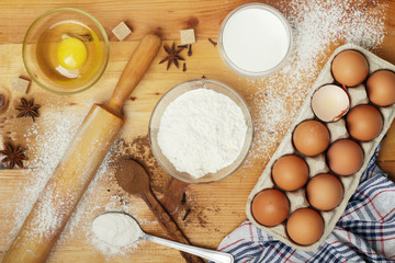 Food ingredients for baking: flour, eggs, milk, sugar	