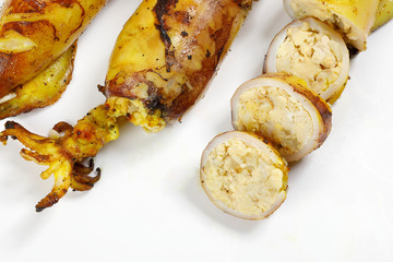 Charcoal grilled stuffed Squid Calamari cattle fish on white background