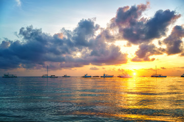 Fototapeta na wymiar Beautiful cloudy sunrise over ocean in Dominican Republic
