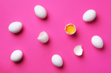 Food concept with white eggs on pink background. Top view. Creative pattern in minimal style. Flat lay