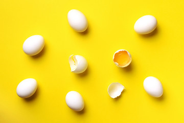 Food concept with white eggs on yellow background. Top view. Creative pattern in minimal style. Flat lay