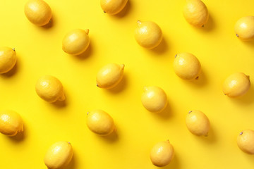 Food pattern with lemons on yellow paper background. Top view. Summer concept. Vegan and vegetarian diet