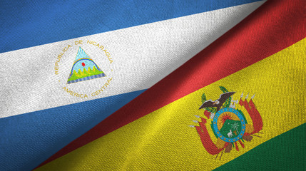 Nicaragua and Bolivia two flags textile cloth, fabric texture 