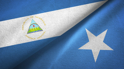 Nicaragua and Somalia two flags textile cloth, fabric texture