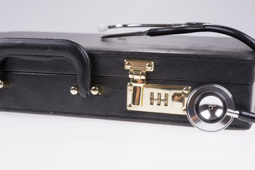 Stethoscope for opening a black leather briefcase