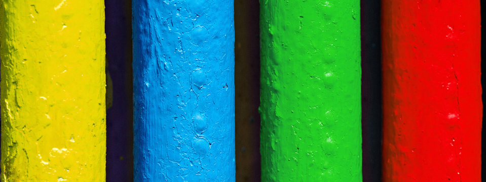 Pipes painted in colors of famous software manufacturer logo. Corporation logo concept. Red, green, blue, yellow tubes colors
