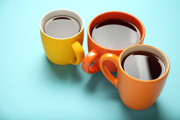 Black tea (coffee) in bright cups, office break, team building.