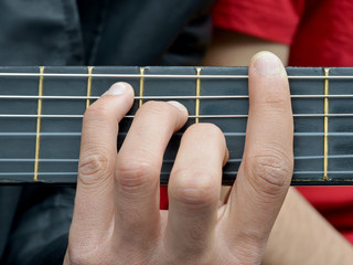 hand with a guitar