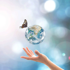 World environment day, ecology and ozone layer protection concept with woman's hand supporting...