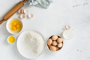 Dough ingredients on a white background top view