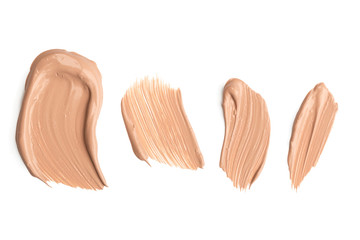 Light beige makeup smear of creamy foundation isolated on white background