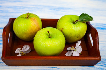 Green apples, flowers and leaves